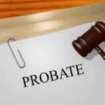 probate papers with a gavel on a wooden table